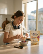 A teenager stirring a Bright AM sachet into yoghurt at the breakfast bar